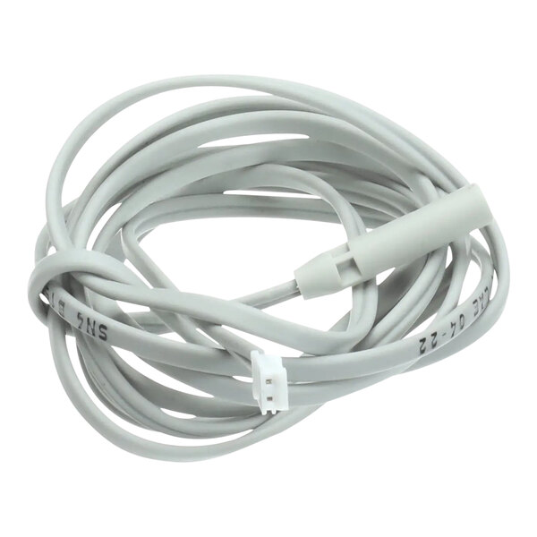 A close up of a white cable with a white connector.