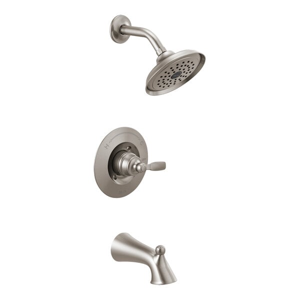 A stainless steel Delta Woodhurst bath and shower faucet with a shower head attached.
