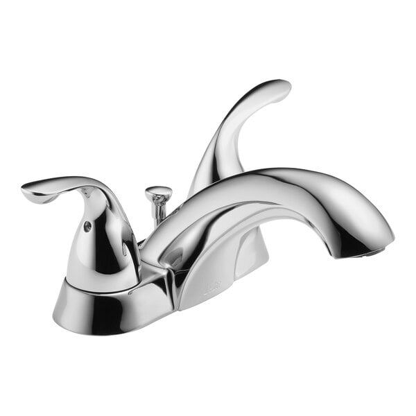 A close-up of a silver Delta deck-mount lavatory faucet with two lever handles.