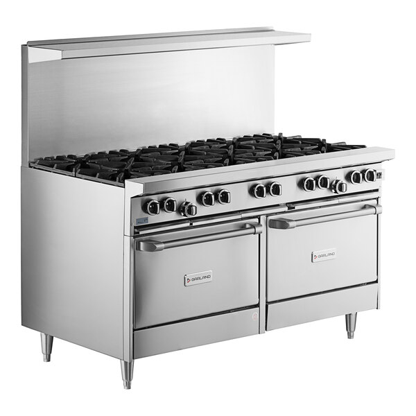 A large stainless steel Garland range with 10 burners and 2 convection ovens.