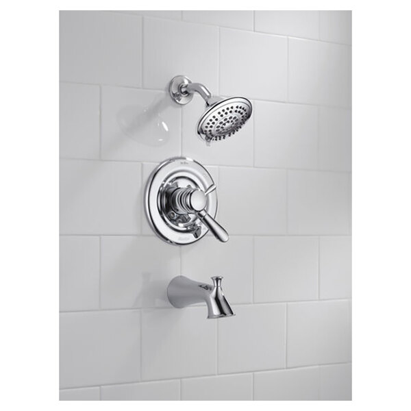 The chrome Delta Lahara bath and shower faucet with a shower head.
