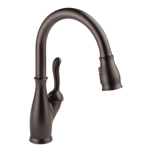 A close-up of a Delta Leland kitchen faucet with a black Venetian bronze finish and pull-down spray wand.