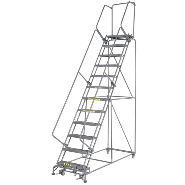 A gray metal Ballymore rolling ladder with serrated treads and wheels.