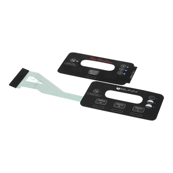 A black rectangular membrane with red and white text.