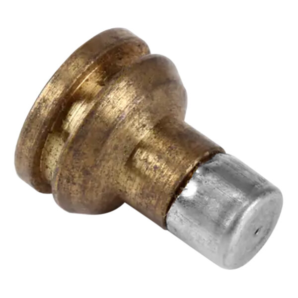 A close up of a Blodgett brass and silver metal burner orifice.
