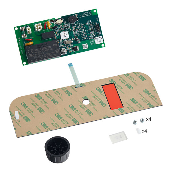 A green circuit board with black plastic tubes.