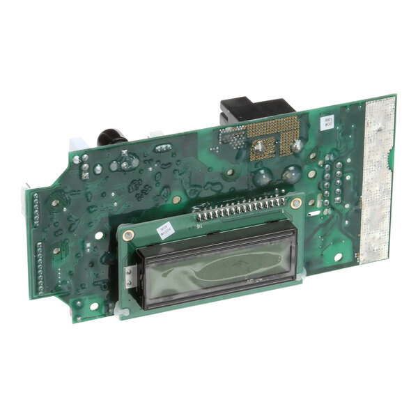A green circuit board with a black display.