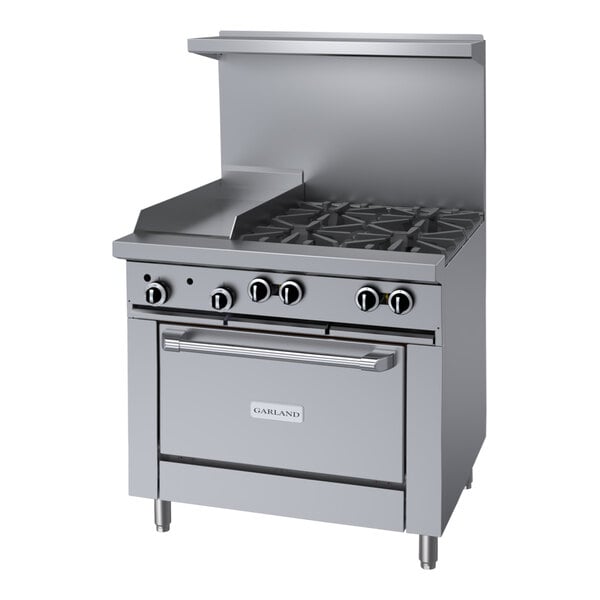 A large stainless steel Garland commercial gas range with 4 burners, a griddle, and a convection oven.