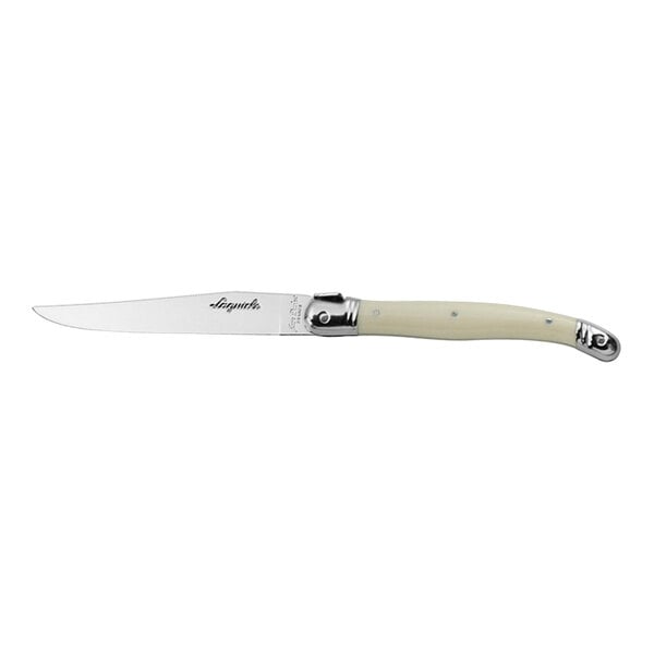 A Jean Dubost Laguiole stainless steel steak knife with an ivory handle.