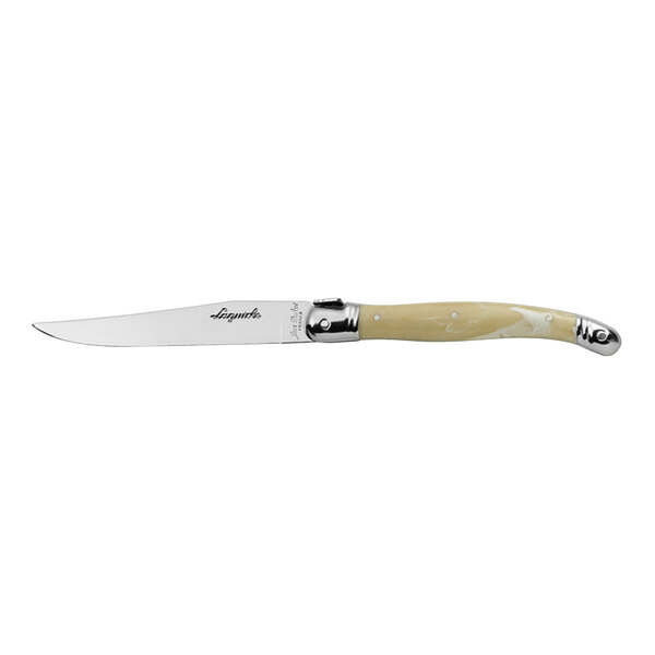 A Jean Dubost stainless steel steak knife with a white ABS handle.