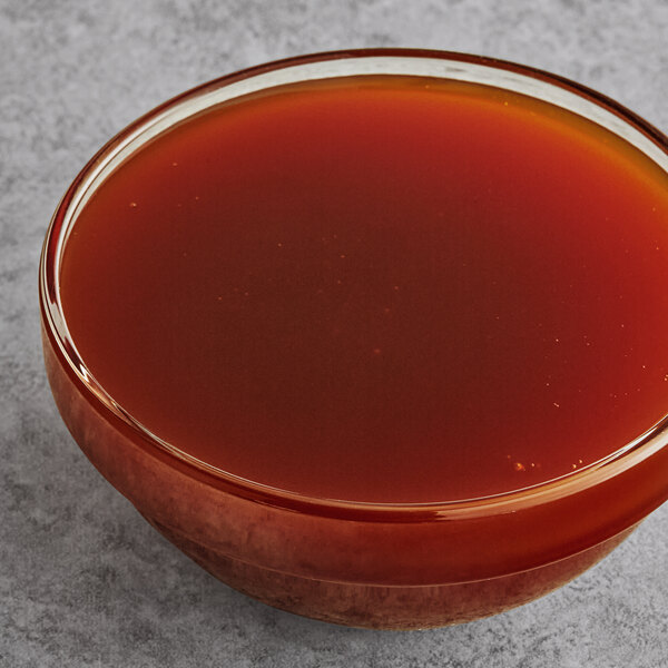 A bowl of MaltRite malted barley extract on a table.