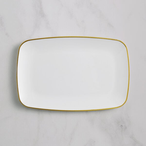 A white rectangular plastic platter with gold trim.