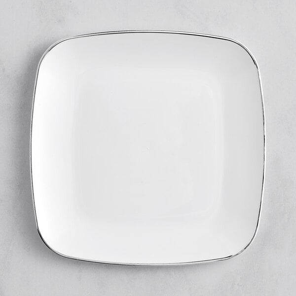 A Visions white square plastic coupe plate with silver trim.
