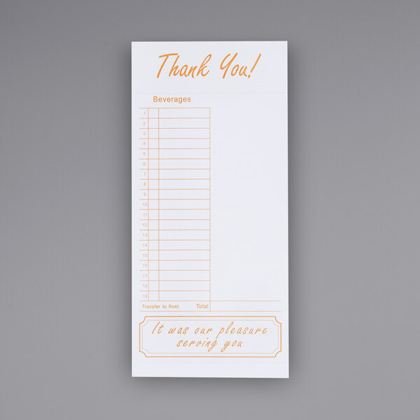 A tan and white Choice guest check on a bar counter with orange writing.