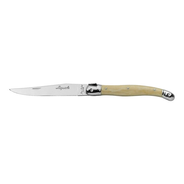 A Jean Dubost Laguiole stainless steel steak knife with a white ABS handle with guilloche and horn detail.