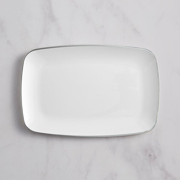A white rectangular plastic plate with silver trim.