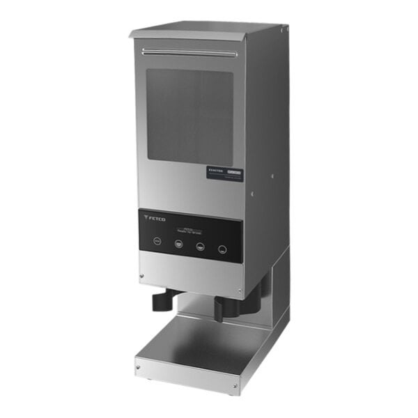 A silver and black Fetco GRS-1201 coffee grinder on a counter.