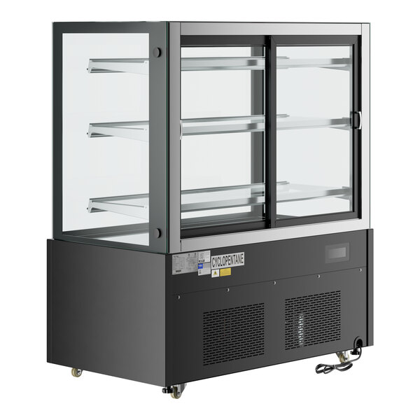An Avantco black refrigerated bakery display case with glass doors on wheels.