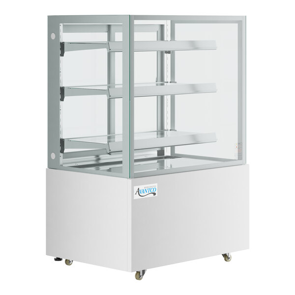 An Avantco white refrigerated bakery display case with glass shelves.