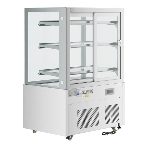 A white Avantco refrigerated bakery display case with glass doors and two shelves.