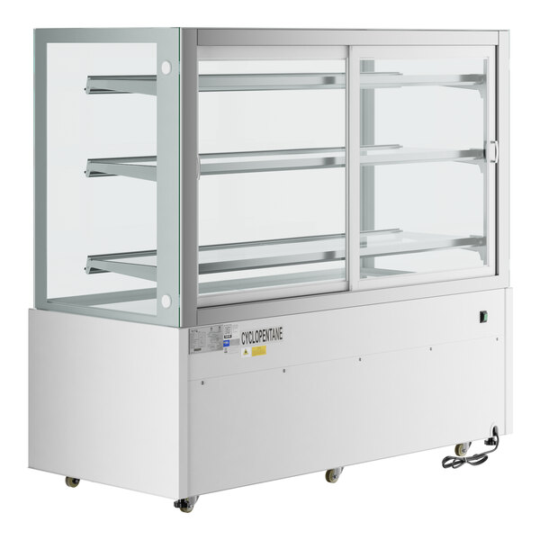 An Avantco white square dry bakery display case with glass doors and LED lighting.