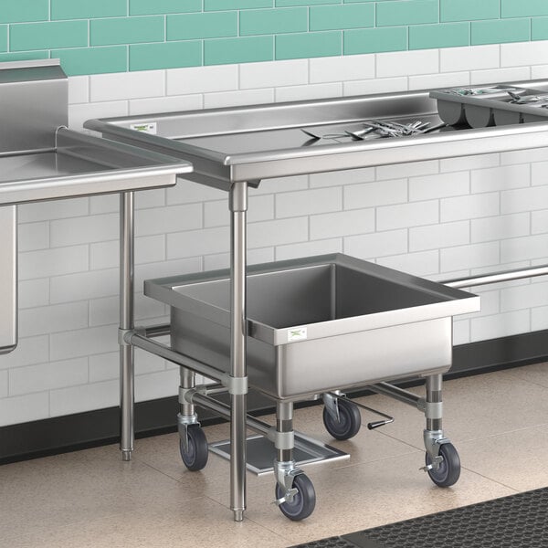 A Regency stainless steel sorting table with a stainless steel sink and two bowls on wheels.