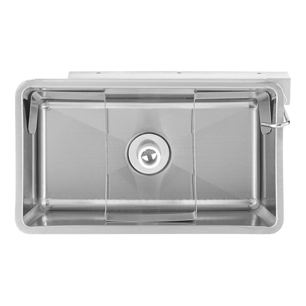 A stainless steel Regency ice cream dipper well with a faucet above a circular hole in a counter.