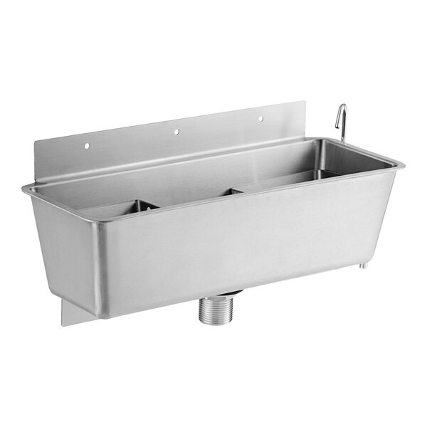 A stainless steel Regency ice cream dipper well with two compartments on a counter.