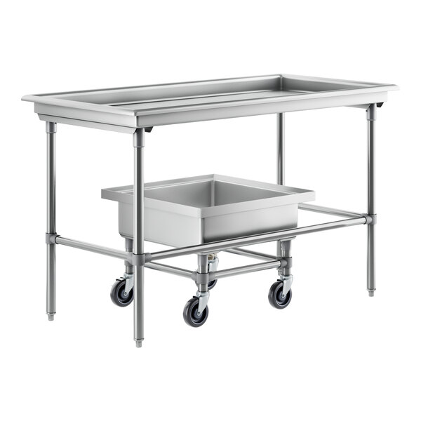 A Regency stainless steel sorting table with a silverware soaking sink and trays on a counter.