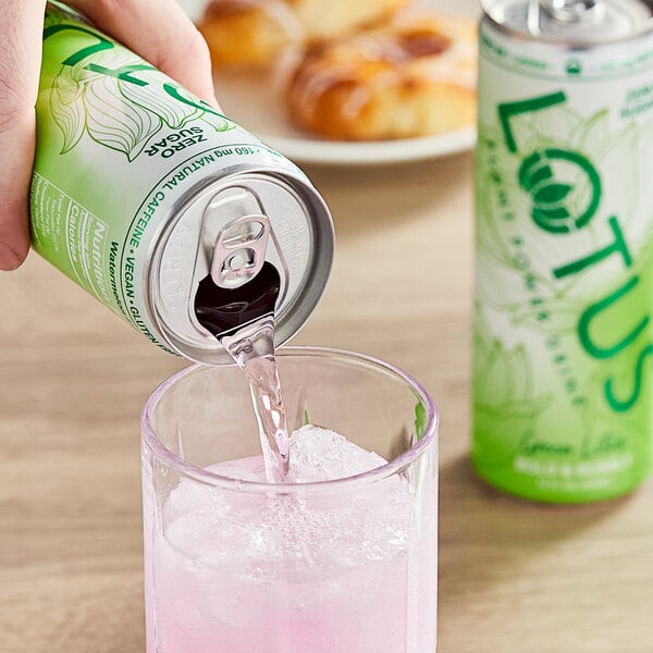 A person pouring Lotus Plant Power Energy Drink into a glass.