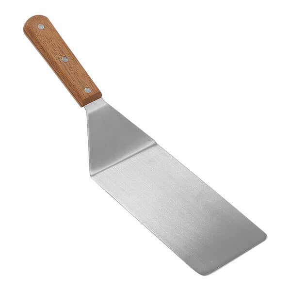 An American Metalcraft stainless steel turner with a wood handle.