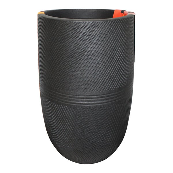 A black round planter with orange trim on the side.