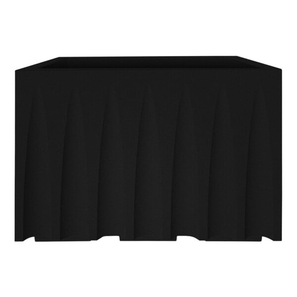 A black rectangular object on a white surface.