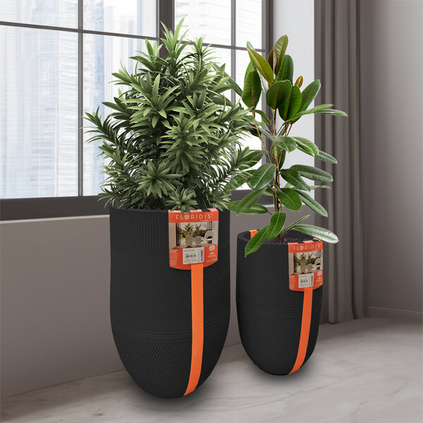 Two Floridis Argos black planters with plants inside.
