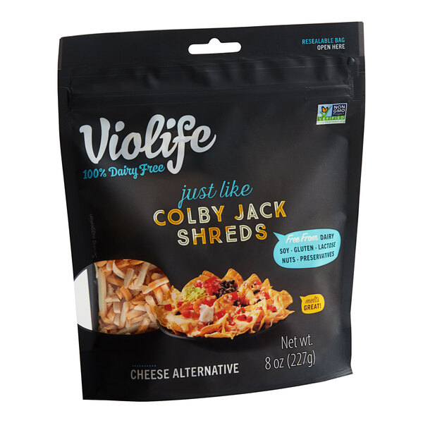 A bag of Violife Just Like Colby Jack Vegan Cheese Shreds on a white background.