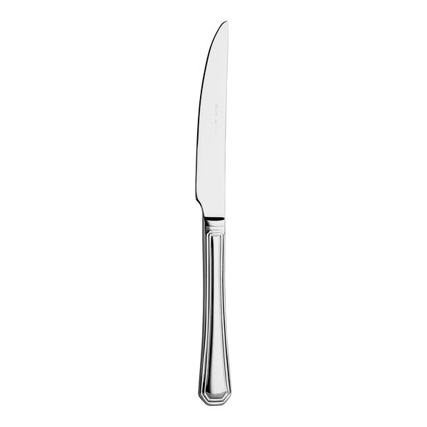 A WNK Deluxe stainless steel steak knife with a silver handle.