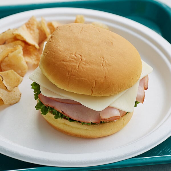 A Martin's Famous sandwich on a plate with chips.
