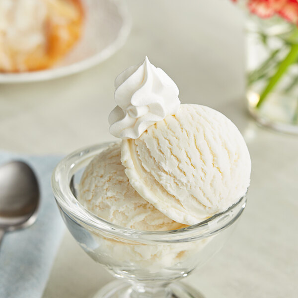 A bowl of Lloyd's of Pennsylvania condensed milk ice cream with a spoon.