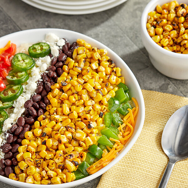 A bowl of Sevillo Fine Foods fire grilled corn with jalapeno peppers.