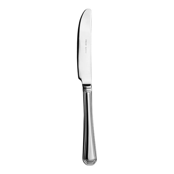 A silver dessert knife with a white handle.