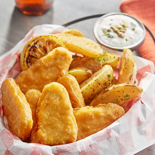 A basket of Gardein plant-based F'sh filets and potato wedges.