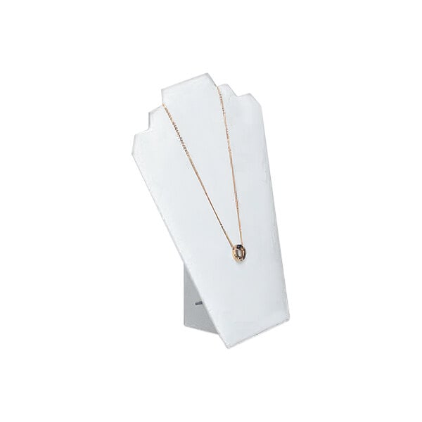 A gold necklace on a white leatherette necklace display stand.