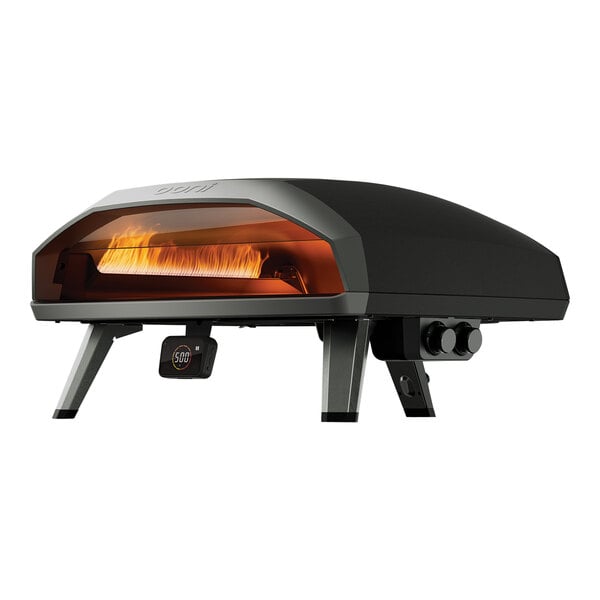 A black rectangular Ooni Koda 2 Max pizza oven with a flame inside on a stand.