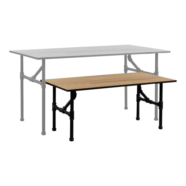 A 47 5/8" x 23 5/8" wood melamine display table with black pipe legs.