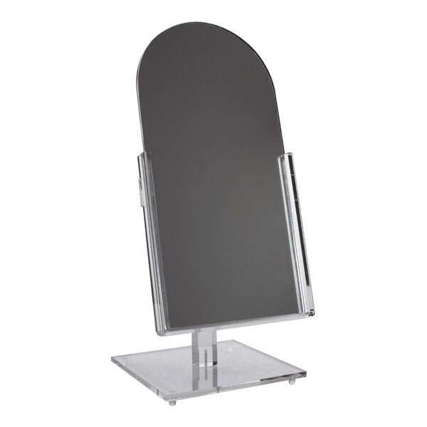 A 6 1/2" x 12" countertop mirror on a clear glass stand.