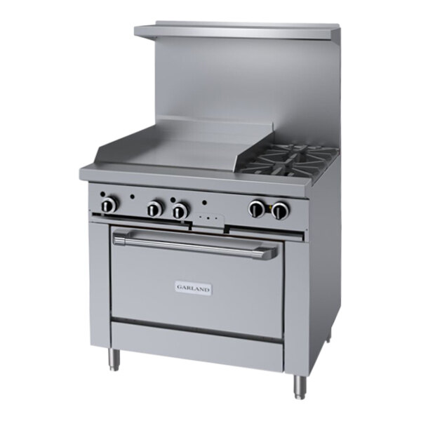 A large stainless steel Garland range with two burners, a griddle, and a convection oven.