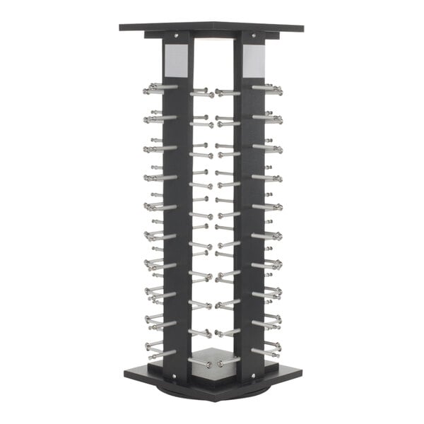 A black wood countertop eyewear spinner display rack holding many different types of glasses.