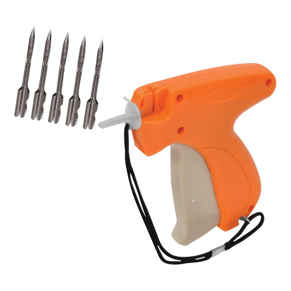 An orange and white standard tagging gun with replacement needles and fasteners.