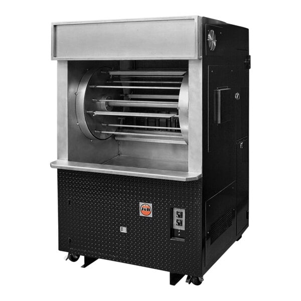 A large black and silver J & R Manufacturing Wood / Gas Rotisserie oven with a round metal cylinder inside.