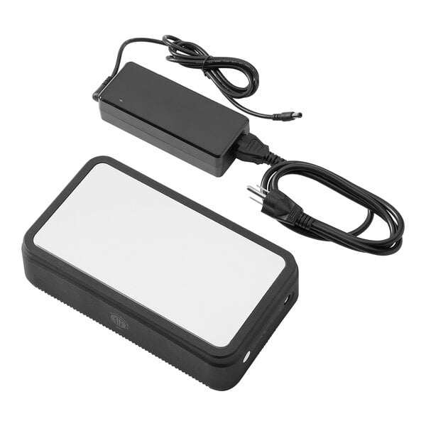 A black rectangular device with a white rectangle on it and wires.